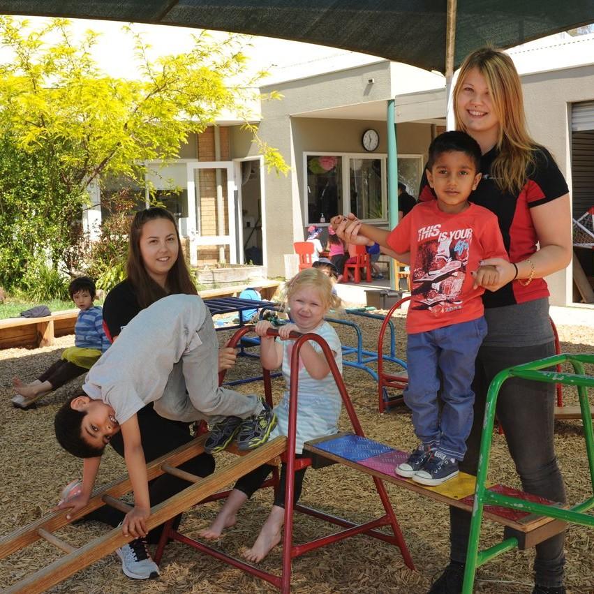 Group of children playing on play equipment
