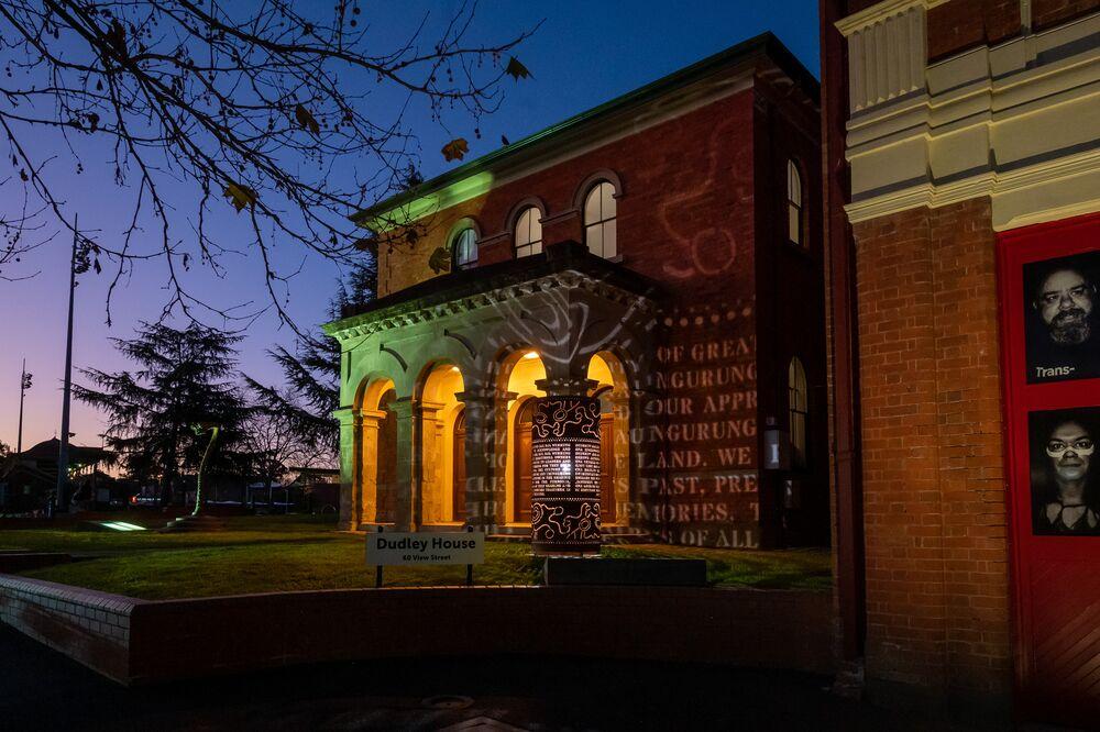 Dudley House at night - Acknowledgement of Country sculpture by Isobel Morphy-Walsh.