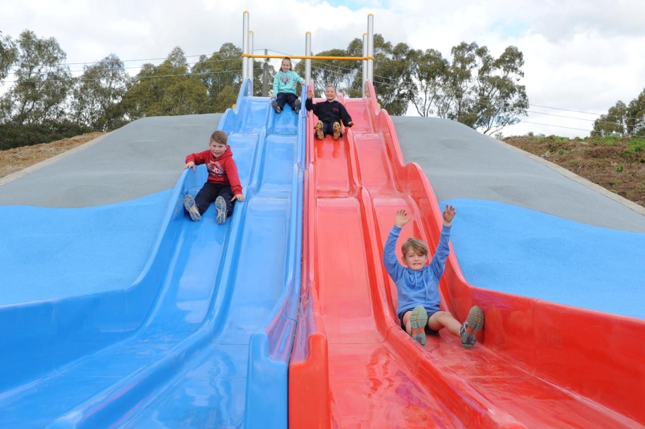 Kids on New Slides at Park