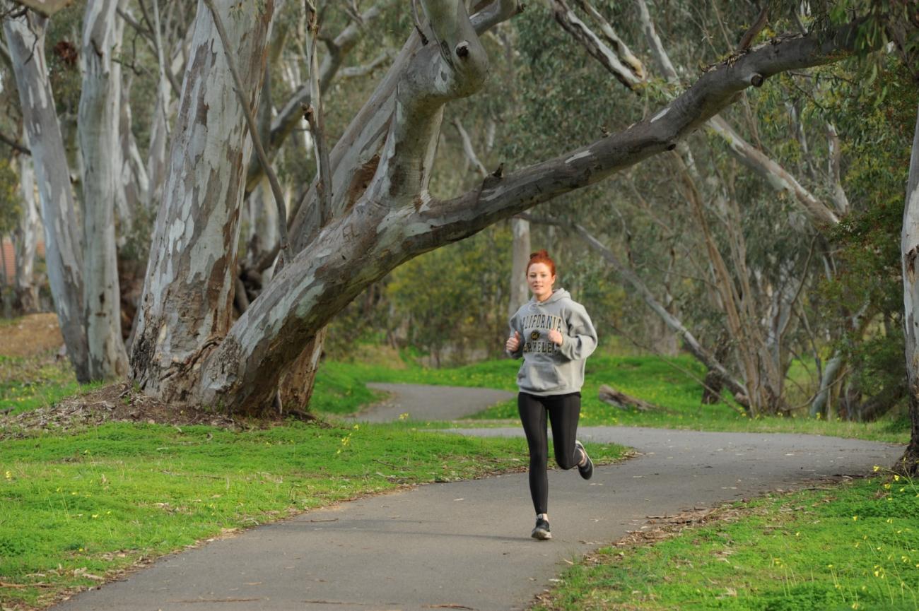 Woman Running in Spring Gully Reserve