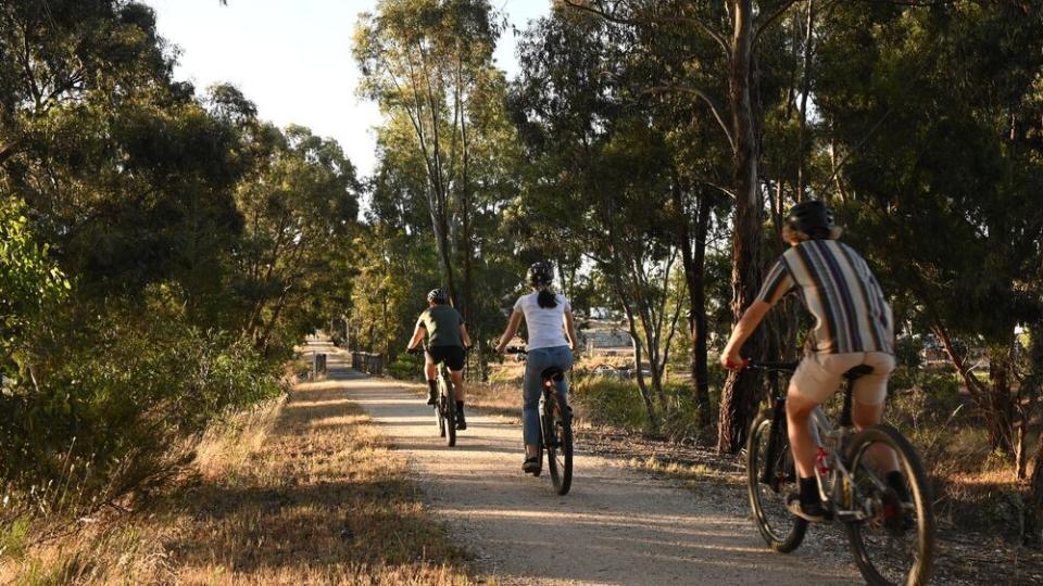 Group cycling on a gravel trail