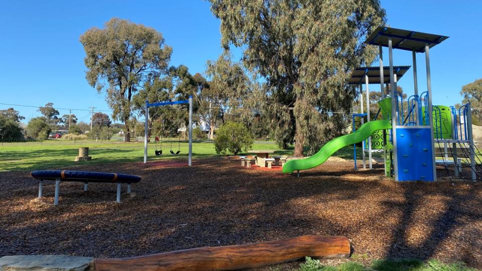 A slide, swings and combination unit are ready for play at Pennington Park playspace.
