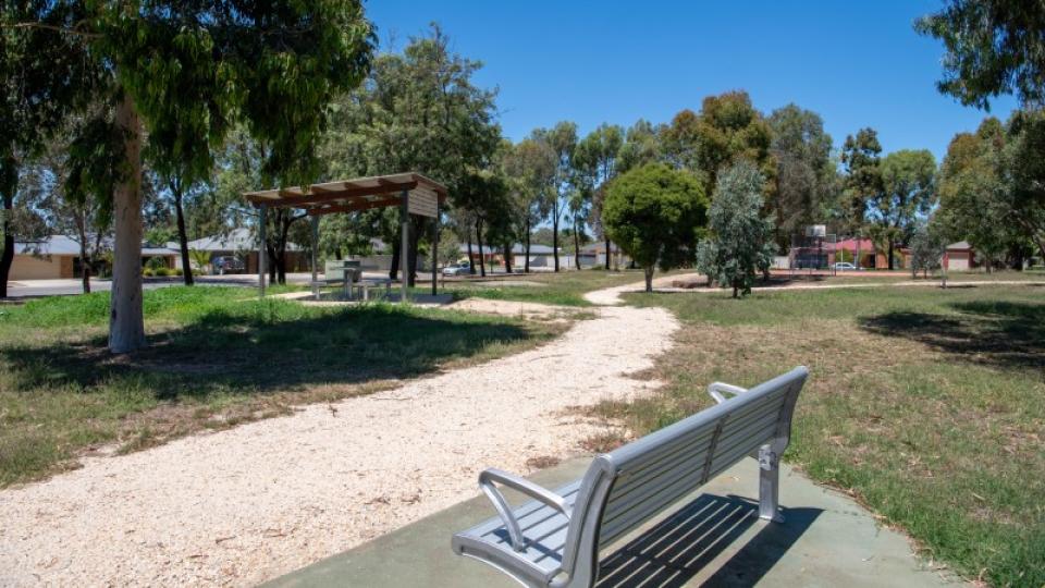 Open park area and seating at Botanical Drive playspace Epsom