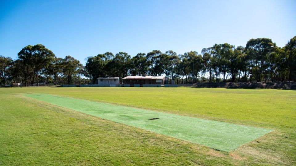 Cricket pitch and building at Maiden Gully Recreation Reserve
