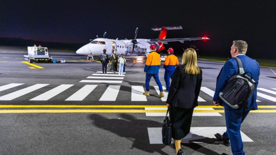 People walking towards a plane at the Bendigo Airport