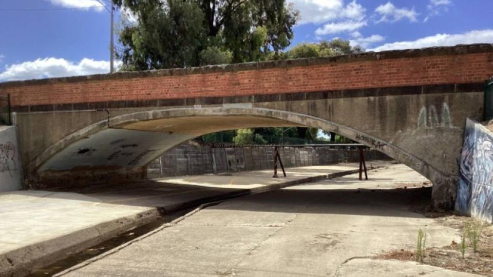 Picture of Booth Street Bridge taken from below next to the creek.